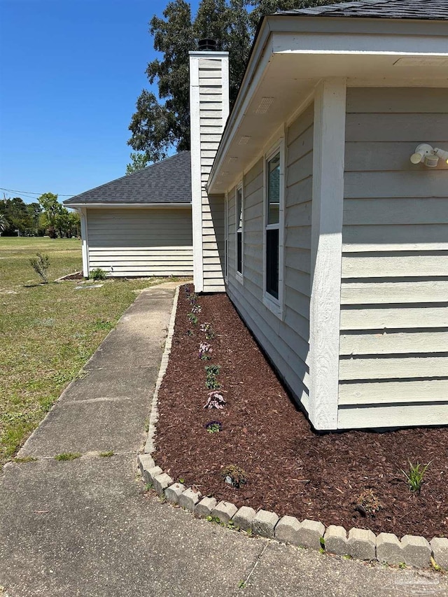 view of side of property with a chimney