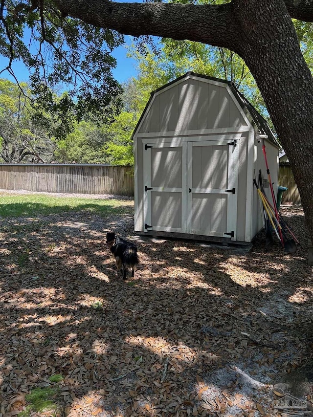 view of shed with fence