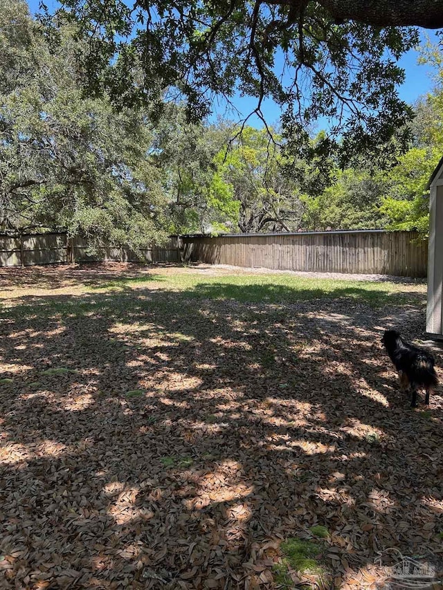 view of yard with a fenced backyard