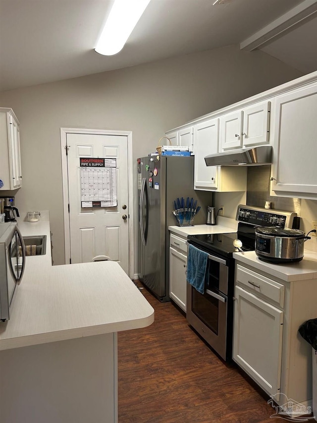 kitchen featuring light countertops, white cabinets, under cabinet range hood, dark wood-type flooring, and stainless steel appliances
