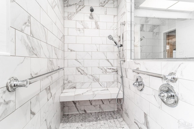 bathroom featuring tiled shower