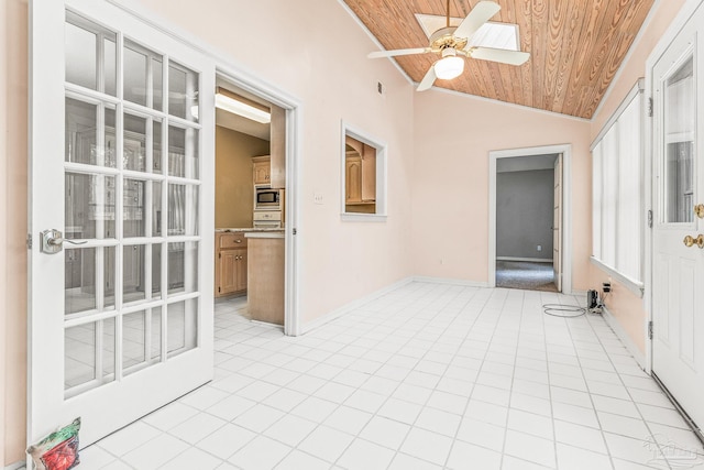 unfurnished sunroom with lofted ceiling, wood ceiling, and ceiling fan