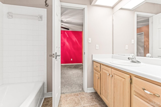 bathroom featuring shower / bathing tub combination, tile patterned floors, and vanity