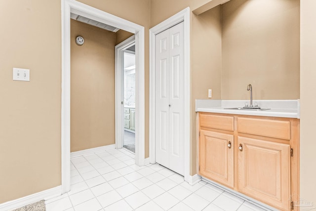 interior space with vanity and tile patterned floors