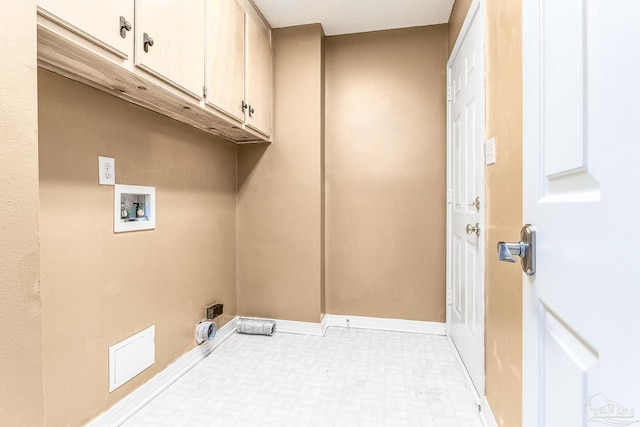 laundry area with hookup for a washing machine, cabinets, light tile patterned floors, electric dryer hookup, and a textured ceiling