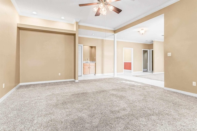 carpeted empty room with ornamental molding and ceiling fan