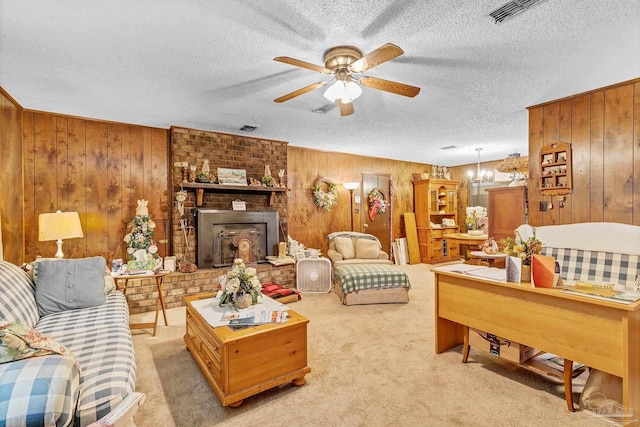 6640 Frank Reeder Rd, Pensacola, FL 32526 - living room with wood walls, ceiling fan, a textured ceiling, light carpet, and a chandelier