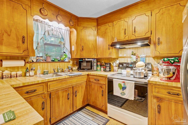 6640 Frank Reeder Rd, Pensacola, FL 32526 - kitchen featuring white range with electric stovetop, under cabinet range hood, wooden counters, brown cabinets, and tasteful backsplash
