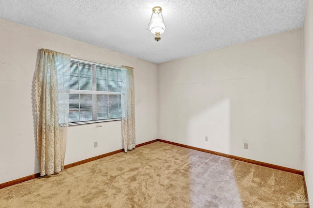 6640 Frank Reeder Rd, Pensacola, FL 32526 - carpeted empty room with a textured ceiling and baseboards