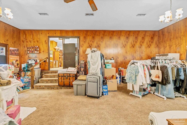 6640 Frank Reeder Rd, Pensacola, FL 32526 - game room featuring a chandelier, carpet floors, wood walls, and ceiling fan