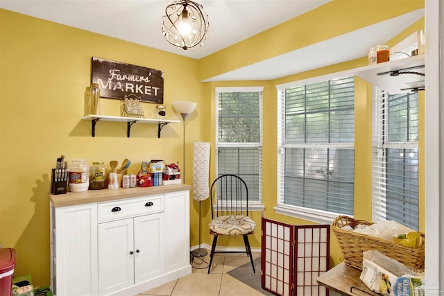 interior space featuring white cabinets and light tile patterned flooring