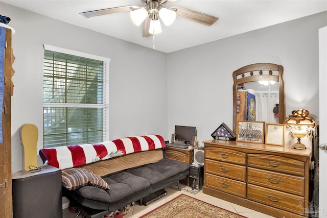 living room featuring tile patterned floors and ceiling fan