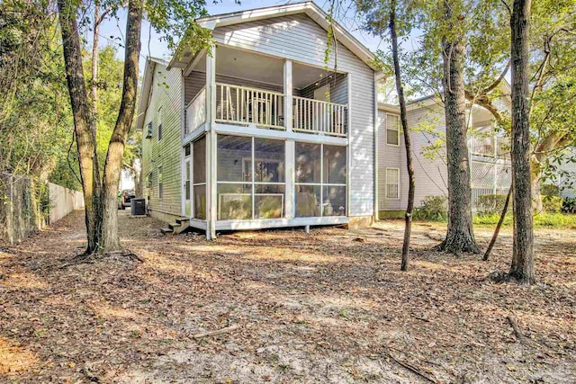 rear view of property with central air condition unit