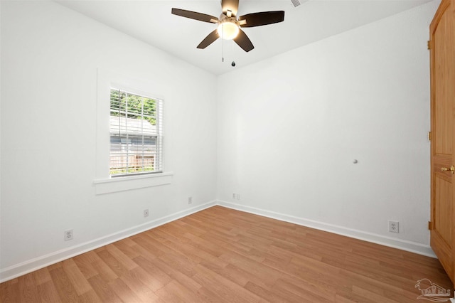 spare room featuring ceiling fan and light hardwood / wood-style flooring