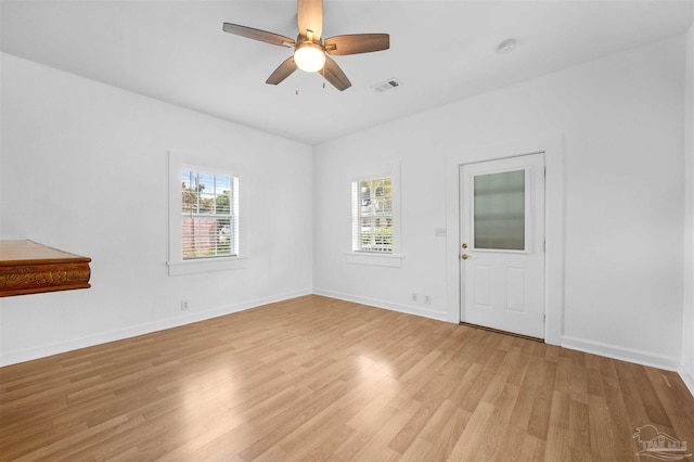 spare room featuring ceiling fan and light wood-type flooring