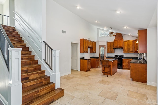 6814 Cedar Lake Dr, Pensacola, FL 32526 - kitchen with black / electric stove, a kitchen island, a sink, visible vents, and dark countertops