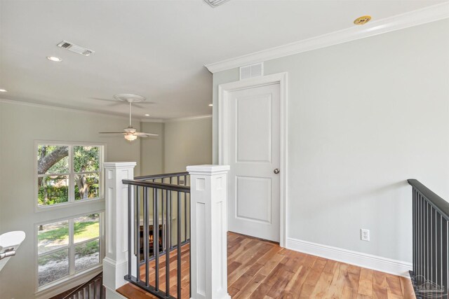 6814 Cedar Lake Dr, Pensacola, FL 32526 - hallway with a healthy amount of sunlight, visible vents, crown molding, and an upstairs landing