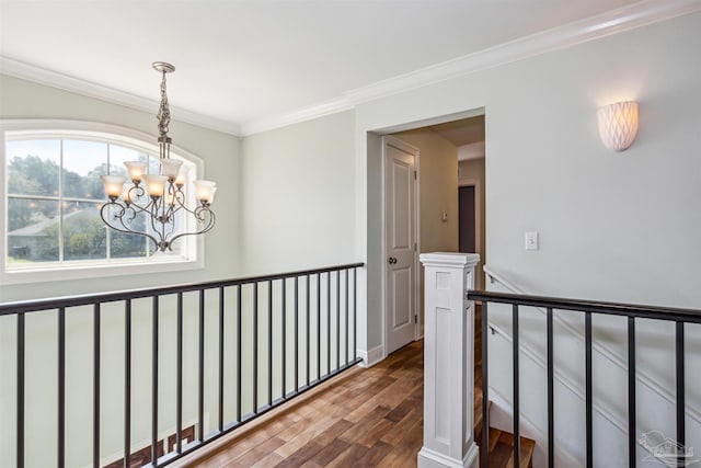 6814 Cedar Lake Dr, Pensacola, FL 32526 - corridor with an inviting chandelier, crown molding, wood finished floors, and an upstairs landing