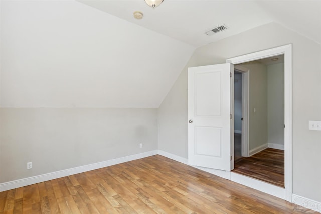 6814 Cedar Lake Dr, Pensacola, FL 32526 - bonus room featuring vaulted ceiling, light wood-type flooring, visible vents, and baseboards