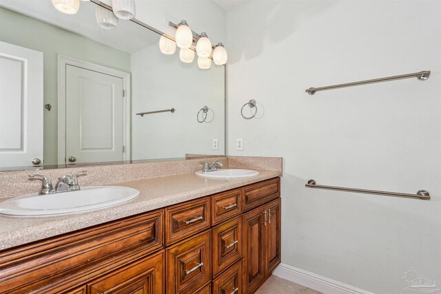 6814 Cedar Lake Dr, Pensacola, FL 32526 - full bath with tile patterned floors, a sink, baseboards, and double vanity