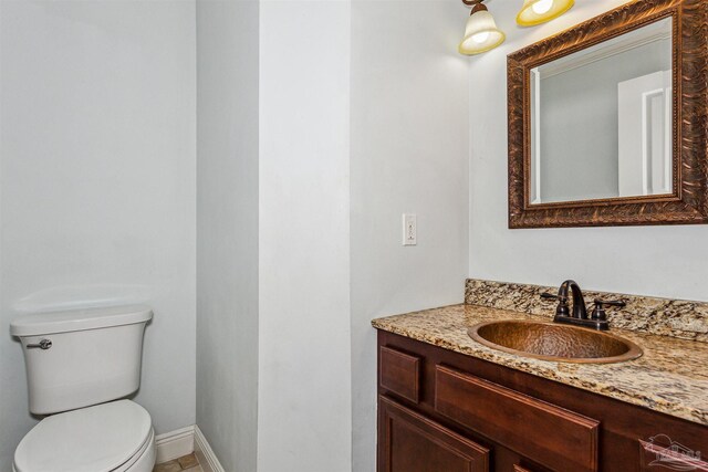6814 Cedar Lake Dr, Pensacola, FL 32526 - half bathroom featuring vanity, toilet, and baseboards