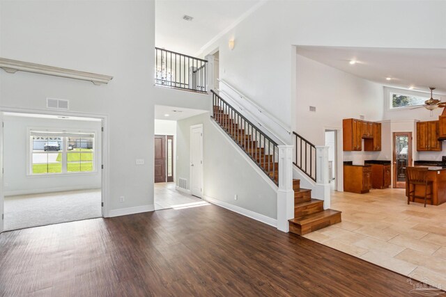 6814 Cedar Lake Dr, Pensacola, FL 32526 - unfurnished living room with a healthy amount of sunlight, baseboards, stairs, and visible vents
