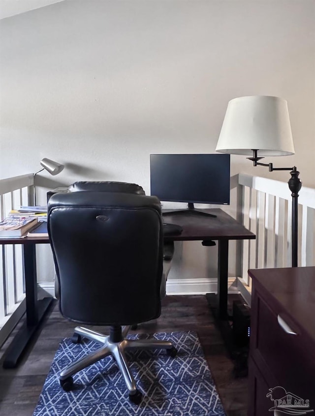 office area featuring baseboards and wood finished floors
