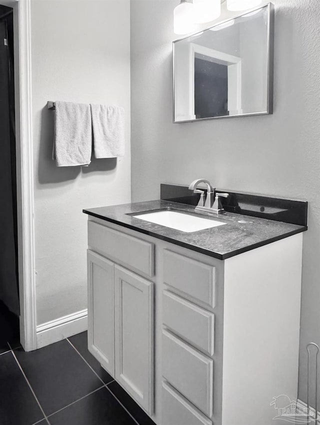 bathroom with tile patterned floors and vanity