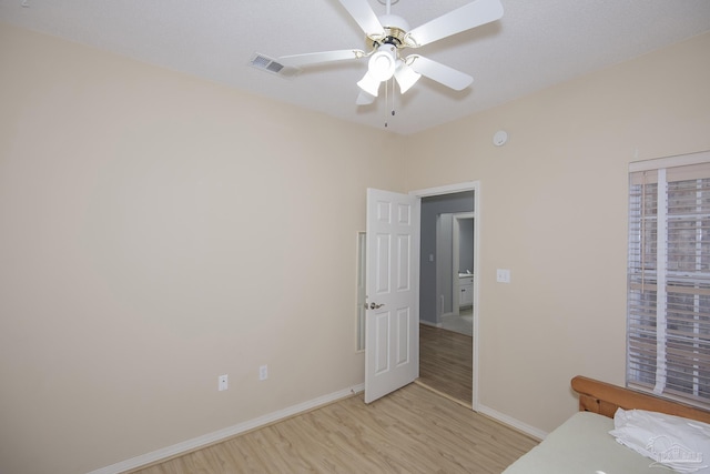 unfurnished bedroom featuring ceiling fan and light hardwood / wood-style floors