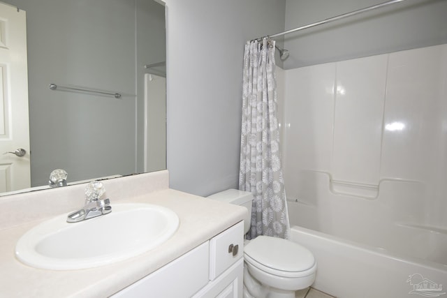 full bathroom featuring vanity, toilet, and shower / bath combo with shower curtain