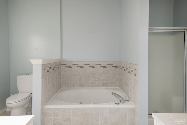 full bathroom featuring shower with separate bathtub, vanity, and toilet