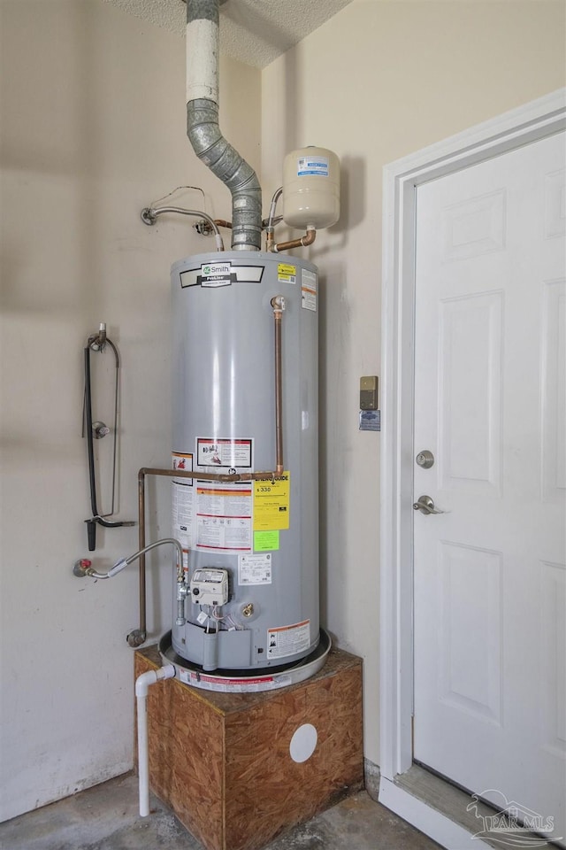 utility room with gas water heater