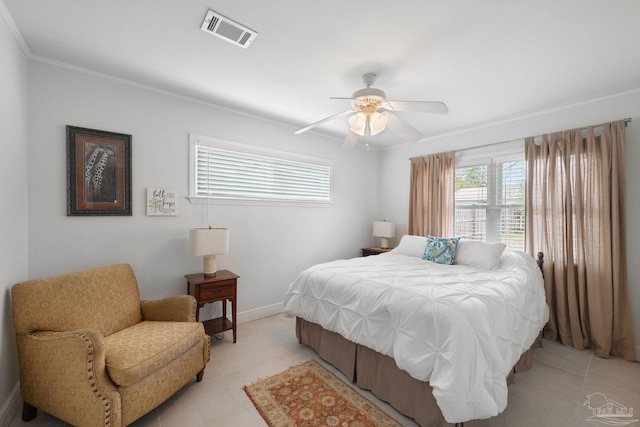 tiled bedroom featuring ornamental molding and ceiling fan