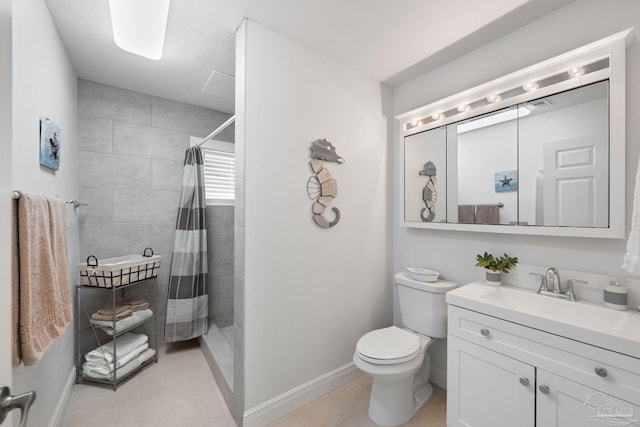 bathroom with vanity, a shower with curtain, tile patterned floors, and toilet