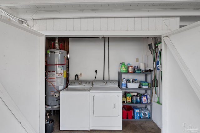 laundry area featuring water heater and washer and dryer