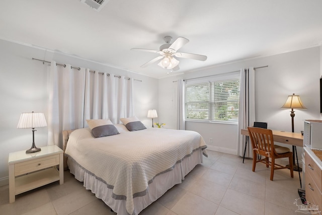 bedroom featuring ornamental molding, light tile patterned floors, and ceiling fan