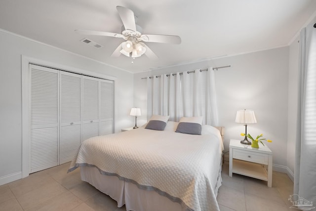 tiled bedroom featuring crown molding, a closet, and ceiling fan