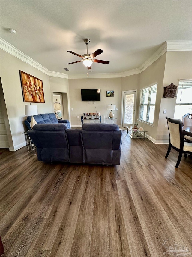 living room featuring ceiling fan, ornamental molding, and hardwood / wood-style floors