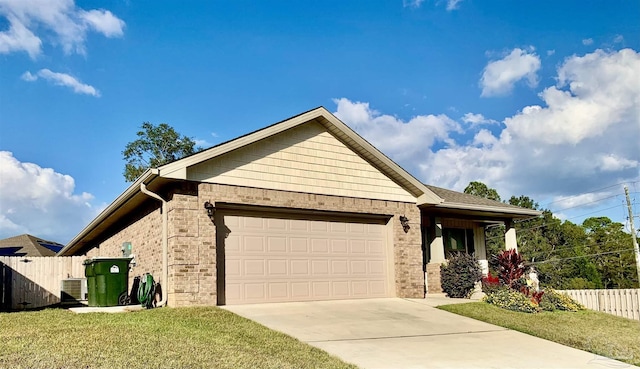 ranch-style home featuring a front lawn, central AC unit, and a garage