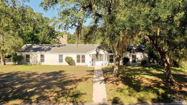 ranch-style house with a front lawn