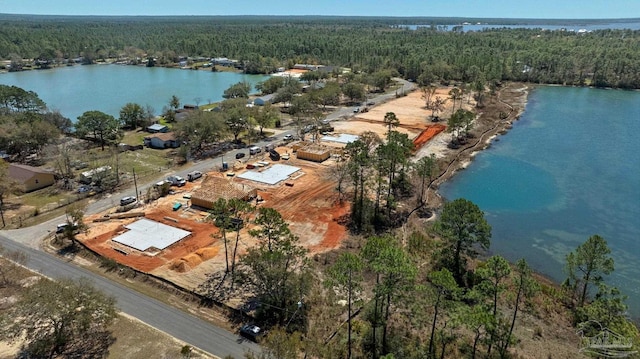 aerial view with a view of trees and a water view