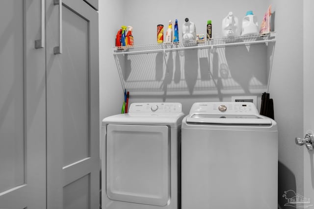 laundry room with independent washer and dryer