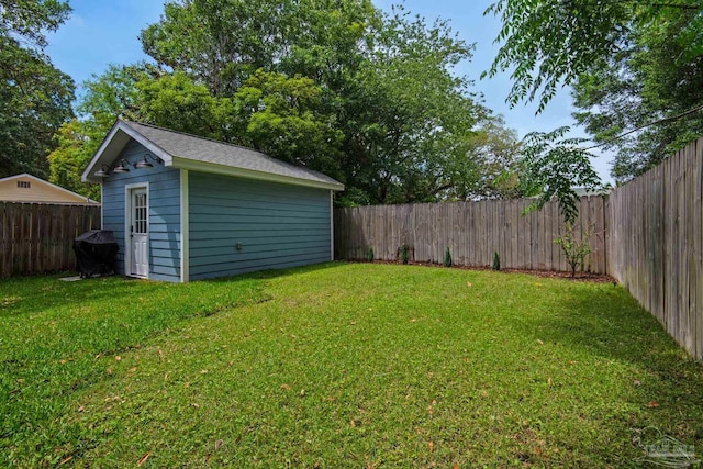 view of yard with an outbuilding and a storage shed