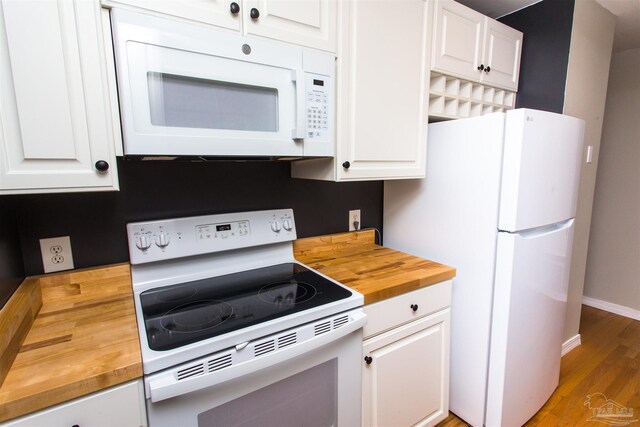 7402 Viewcrest Dr, Pensacola, FL 32504 - kitchen with butcher block counters, white appliances, and white cabinetry