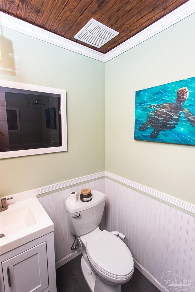 7402 Viewcrest Dr, Pensacola, FL 32504 - bathroom with wainscoting, vanity, and toilet