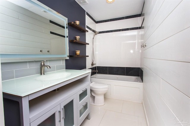 7402 Viewcrest Dr, Pensacola, FL 32504 - bathroom featuring tile patterned flooring, shower / bathtub combination, tile walls, toilet, and vanity