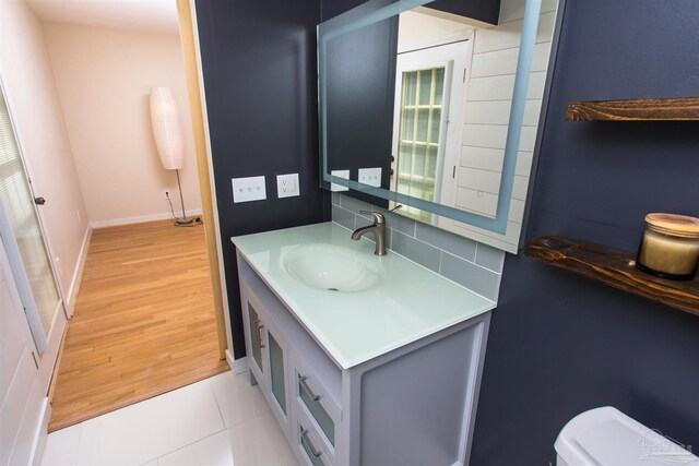 7402 Viewcrest Dr, Pensacola, FL 32504 - half bath with vanity, toilet, baseboards, and tile patterned flooring