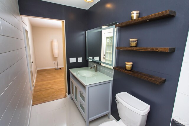 7402 Viewcrest Dr, Pensacola, FL 32504 - bathroom featuring toilet, vanity, baseboards, and tile patterned flooring