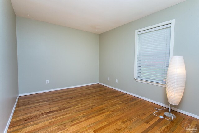 7402 Viewcrest Dr, Pensacola, FL 32504 - spare room featuring wood finished floors and baseboards