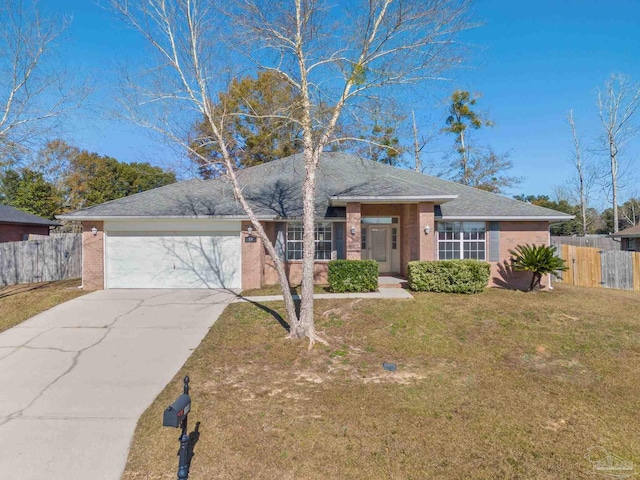 single story home with a garage and a front yard